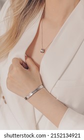 Woman Wearing Elegant Classic Silver Pendant Necklace On Close-up