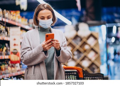 Woman Wearing Face Mask And Shopping In Grocery Store