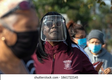 A Woman Wearing A Face Shield Lines Up For COVID-19 Test During A Free COVID-19 Testing In Los Angeles, Wednesday, Nov. 25, 2020.  (Ringo Chiu Via AP)