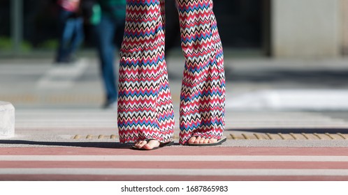 Woman Wearing Flare Pants Printed With A Sandal.