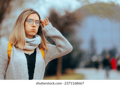 
Woman Wearing Glasses Checking something in the Distance. Myopic girl having vision problems with he old pair 

 
