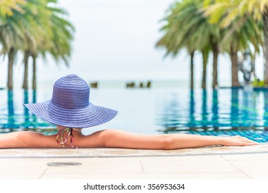 Woman Wearing Hat In The Hotel Pool Resort