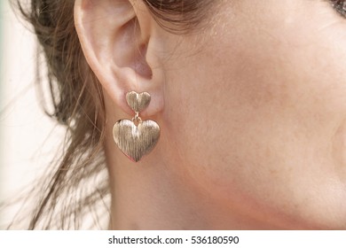 Woman Wearing A Heart Shape Earring