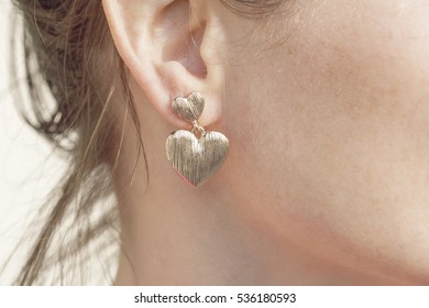 Woman Wearing A Heart Shape Earring