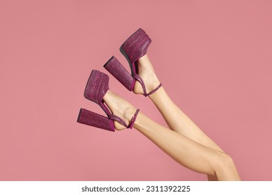 Woman wearing high heeled shoes with platform and square toes on pink background, closeup - Powered by Shutterstock