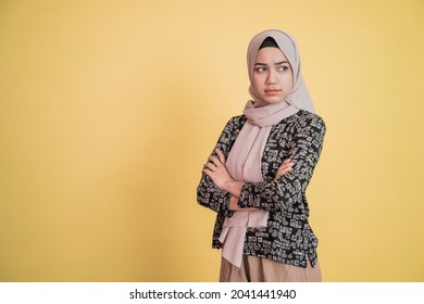 woman wearing hijab angry jealous with crossed arms while standing