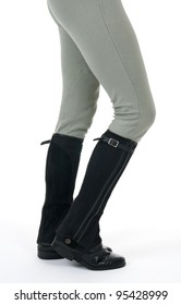 Woman Wearing Horse Riding Boots And Breeches, On White Background.