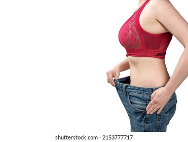 Woman Wearing Jeans That Are Too Big. Woman With Loose Jeans. Woman Is Measuring Waist After Weight Loss,. Approving Diet Wearing Old Too Big Jeans. Diet Concept