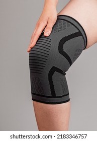 Woman wearing knee pad to reduce pain. Sprained, ruptured ligaments, meniscus tear, tendinitis, arthritis. Health problems, medical conditions concept. High quality photo