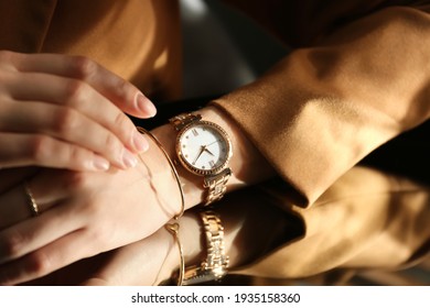 Woman Wearing Luxury Wristwatch Near Mirror, Closeup