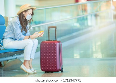 Woman wearing a mask for prevent virus with baggage in international airport. Protection against Coronavirus and gripp