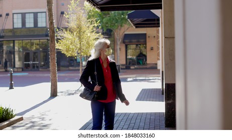 Woman Wearing A Mask Window Shopping During Covid