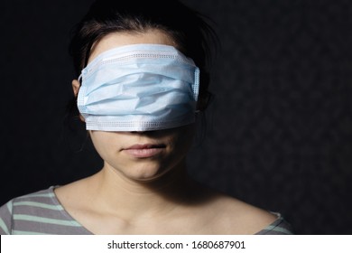 Woman Wearing Medical Mask Cover Eyes. Concept Misinformation. Virus Prevention.