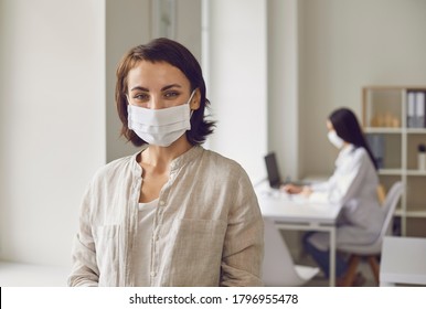 Woman Wearing Medical Mask On Visit To Doctor At Clinic. Patient At Hospital After Consultation