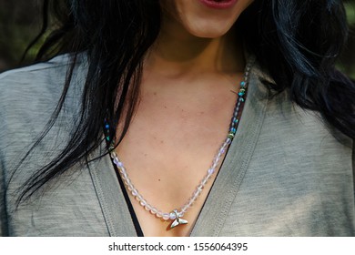 Woman Wearing Mineral Stone Mala Necklace With Wale Tale Silver Pendant