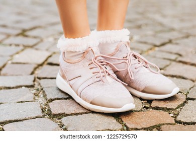 Woman Wearing New Comfy Trainers And Soft Pink Ruffle Socks, Close Up Image