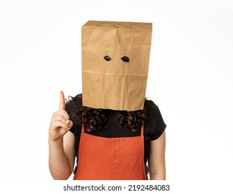 Woman Wearing Paper Bag Over Her Head Holding Up One Finger