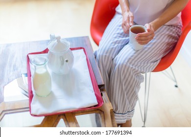 Woman Wearing Pijama Holding Cup Of Tea In The Morning