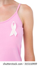 Woman wearing pink ribbon for breast cancer awareness on white background - Shutterstock ID 315110909