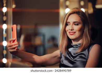 
Woman Wearing Professional Makeup in a Salon Taking Selfies
Stunning confident lady wearing red lips checking herself in the phone camera
 - Powered by Shutterstock