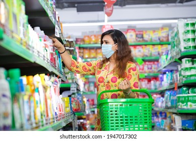 Woman Wearing Protective Mask Buying Food In Grocery Store During Virus Epidemic