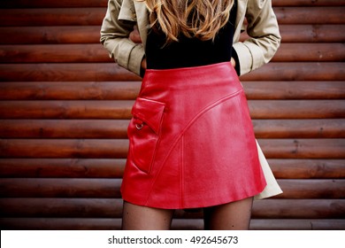 Woman Wearing Red Leather Skirt. Fashion Details