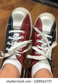 A Woman Is Wearing Retro Bowling Shoes In A Bowling Alley In Florida.