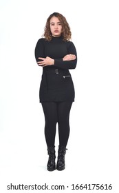 Woman Wearing Skirt And Boots On White Background, Arms Crossed And Serious