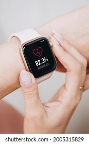 Woman wearing a smartwatch mockup to check her heart rate
