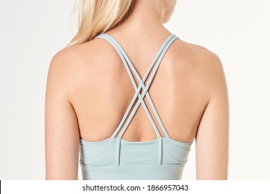 Woman wearing a sports bra mockup with criss cross strap