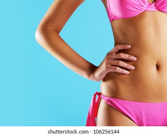 Woman Wearing String Bikini, Close-up Of Abdomen