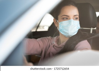 Woman Wearing Surgeon Mask In Car 