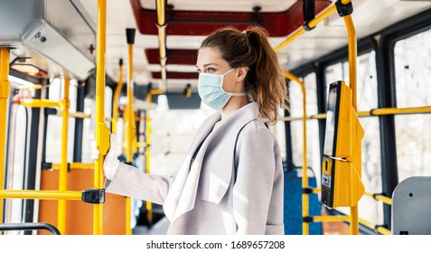 Woman Wearing Surgical Protective Mask In A Public Transportation