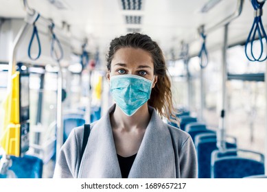 Woman Wearing Surgical Protective Mask In A Public Transportation