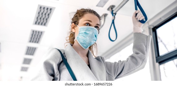 Woman Wearing Surgical Protective Mask In A Public Transportation