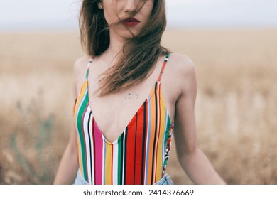 Woman wearing swimsuit standing in field - Powered by Shutterstock