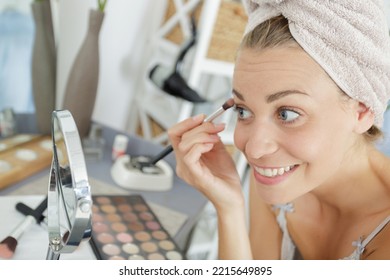 Woman Wearing Towel On Head Applying Make-up Eyelashes