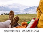 Woman wearing trekking shoes and lying in tent outdoors, closeup