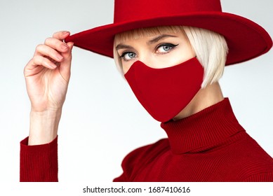 Woman Wearing Trendy Fashion Outfit During Quarantine  Of Coronavirus Outbreak. Total Red Look Including Protective Stylish Handmade Face Mask
