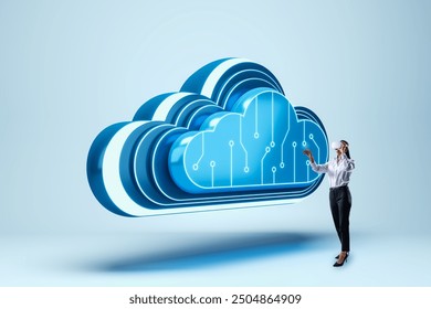 A woman wearing VR glasses interacts with a large digital cloud icon. The background is light blue, representing modern technology and cloud computing concepts - Powered by Shutterstock