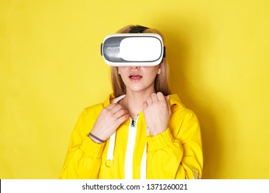 Woman Wearing VR Goggles. Full Of Expression.