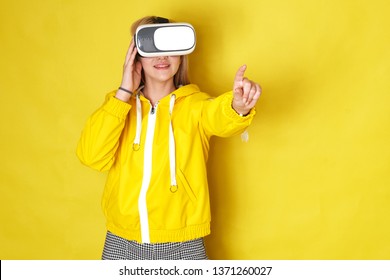 Woman Wearing VR Goggles. Full Of Expression.