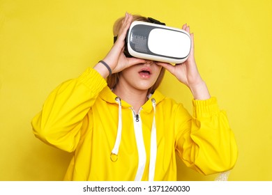 Woman Wearing VR Goggles. Full Of Expression.