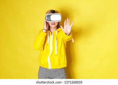 Woman Wearing VR Goggles. Full Of Expression.