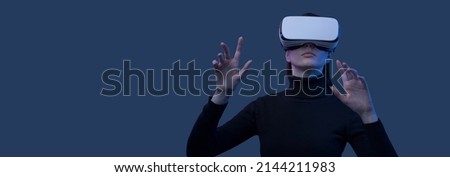 Woman wearing a VR headset and interacting with virtual reality interfaces 商業照片 © 