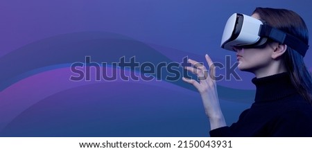 Woman wearing a VR headset and interacting with virtual reality, simulation and metaverse concept