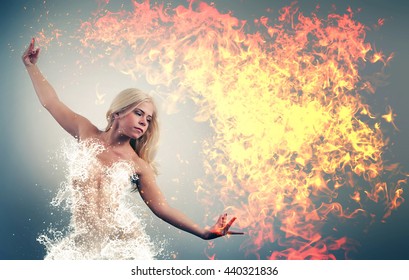 Woman wearing a water dress playing with fire
