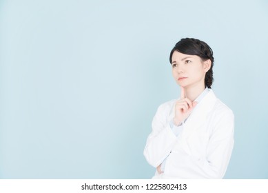 woman wearing white coat