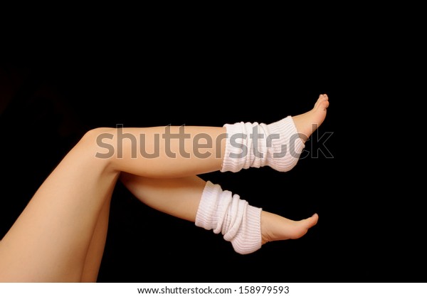 Woman wearing white leg\
warmers