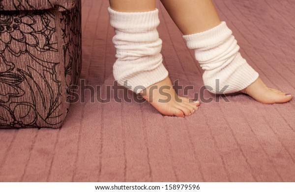 Brunette Woman Wearing Bodysuit and Leg Warmers Stock Photo